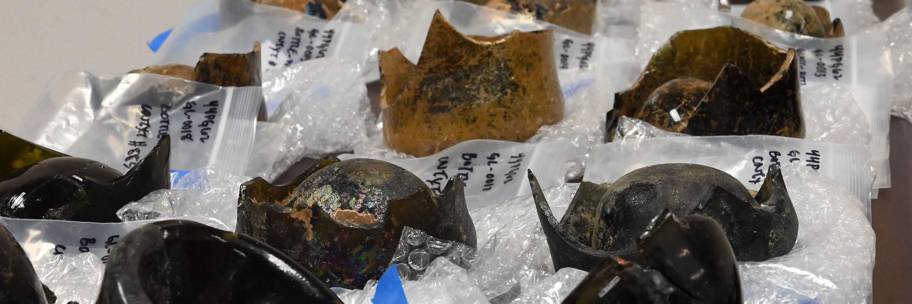 Closeup of glass bottle artifact inventory