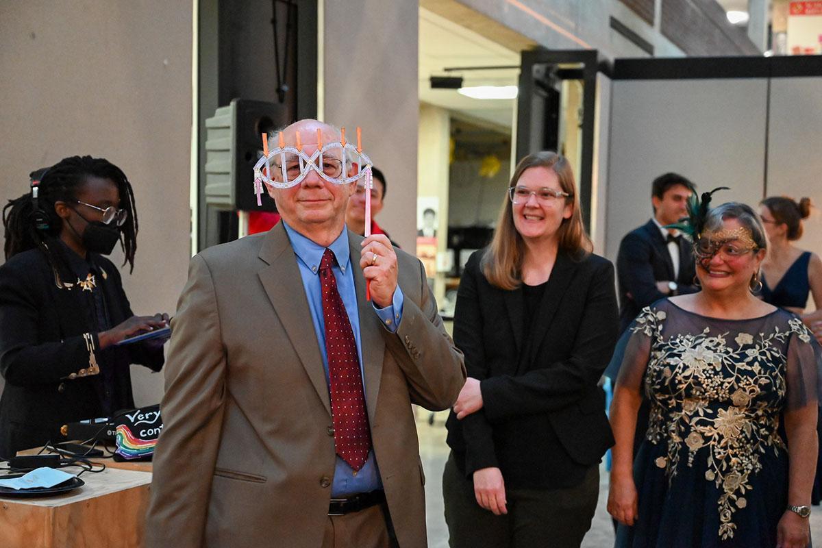 Mike Binder holding a structural design mask