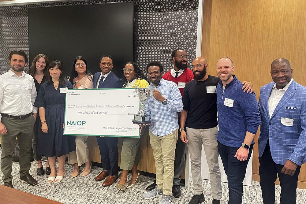 Student winners of the NAIOP challenge posing with a trophy and big check