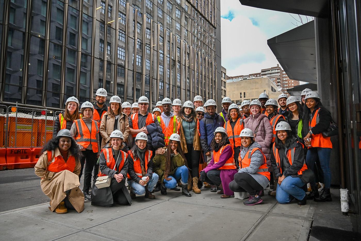 Students and faculty wearing hard hats and safety vests in New York City