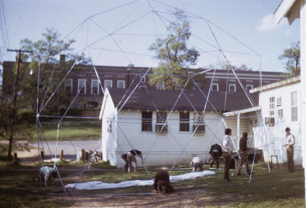Roger Lewis and Students building a dome structure