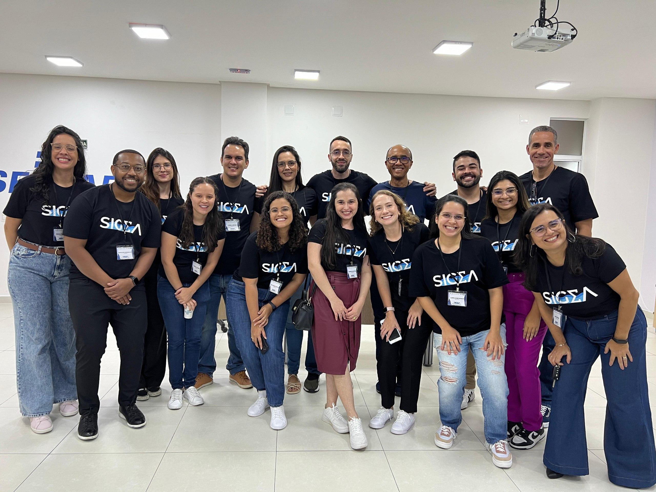Group shot of people wearing the same SIGMA t-shirt