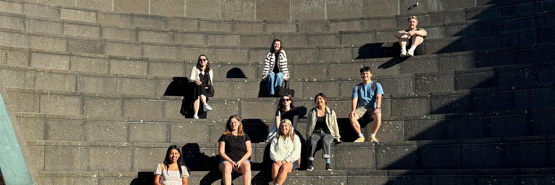 Group of students sitting on steps
