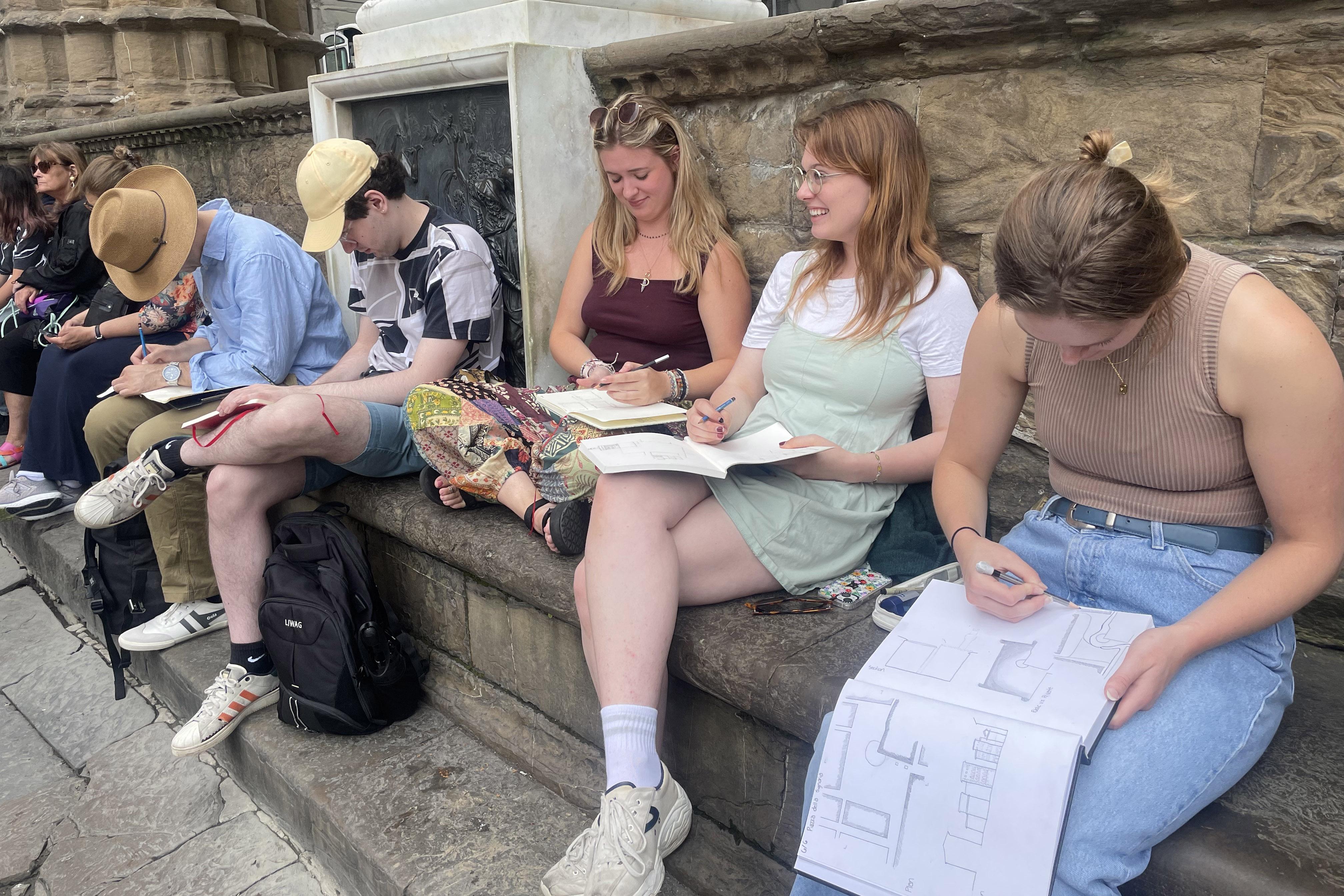 Students drawing outside in Italy