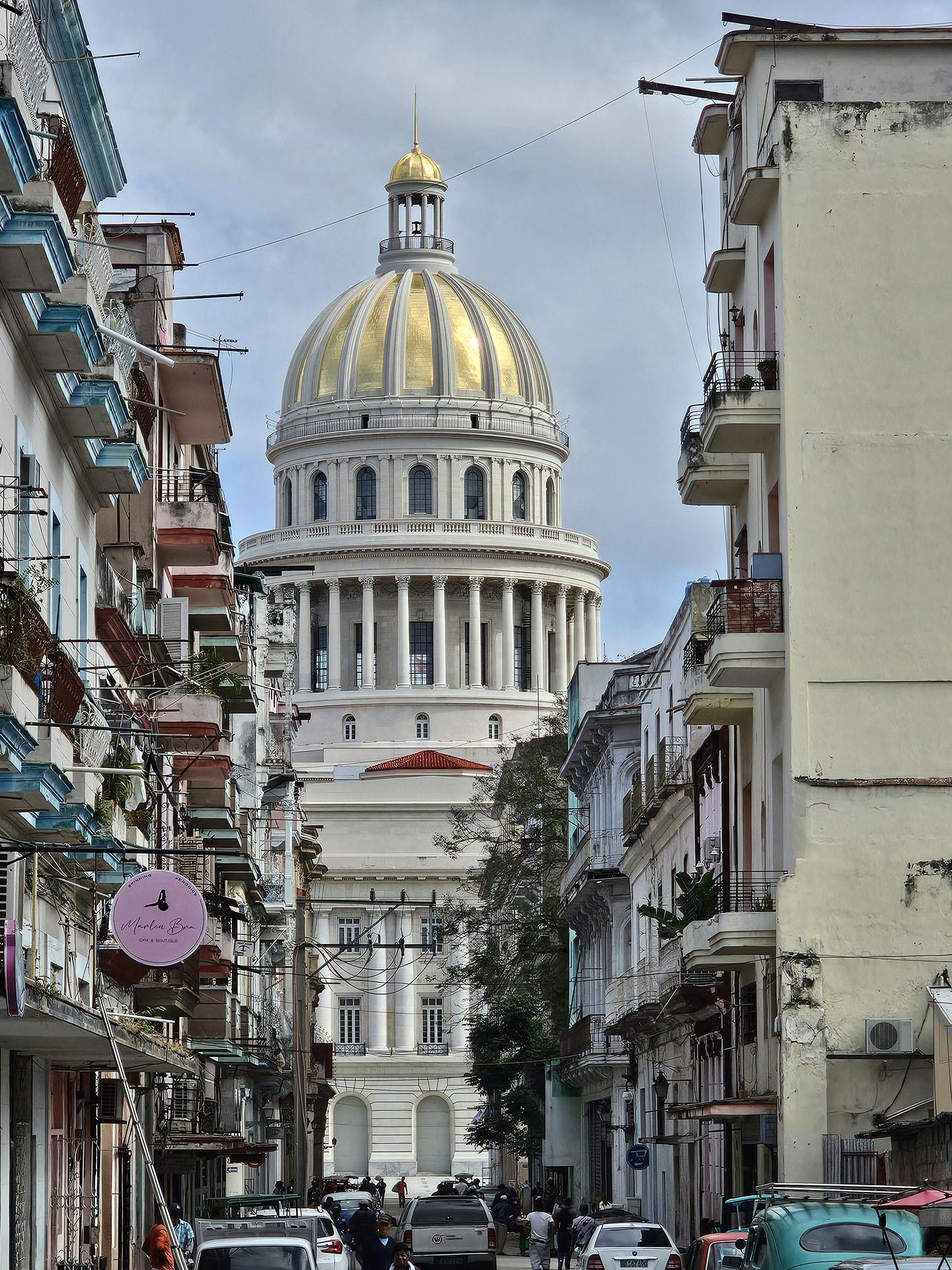 Cuban Capitol in the background with colorful buildings in the foreground