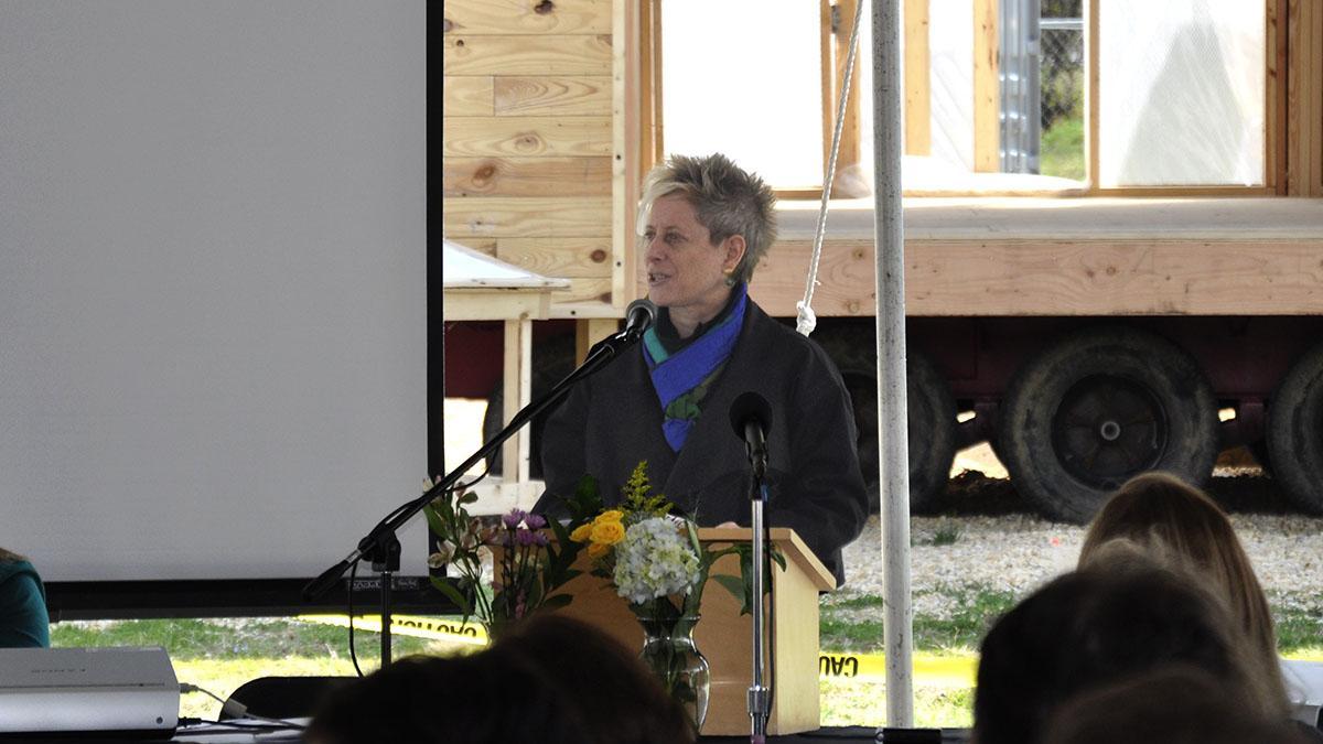 Amy Gardner speaking at a podium