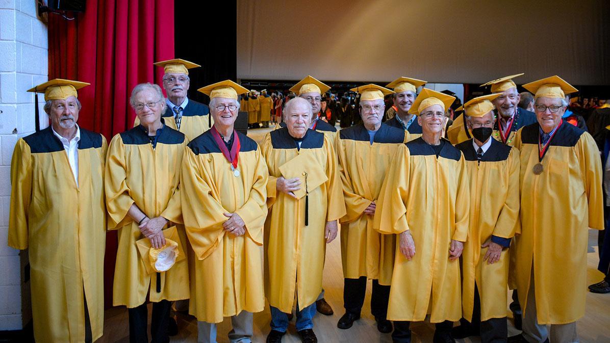 The Class of 1972 in Golden graduation gowns