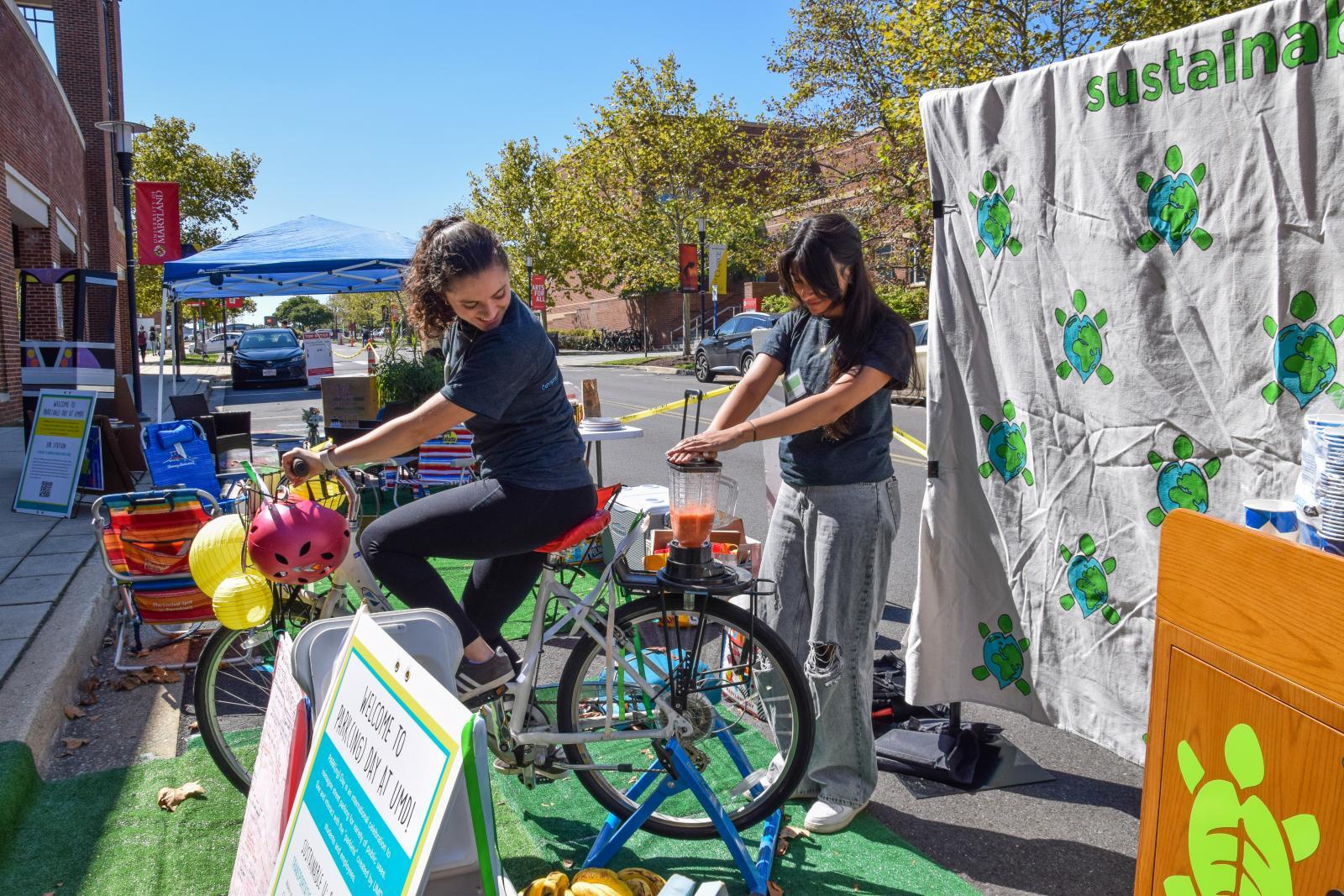 A student riding a bike which powers a smoothie