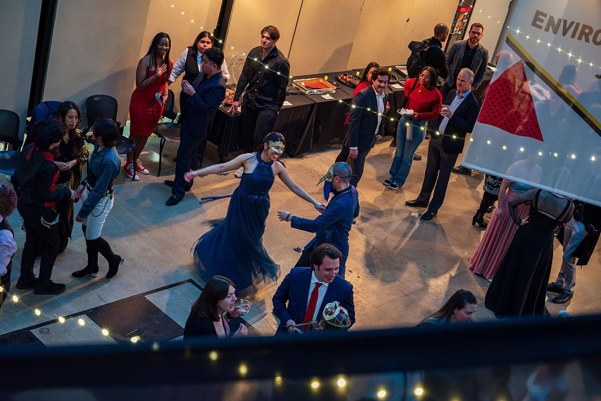 A couple dancing at a the Venetian-themed Beaux Arts ball