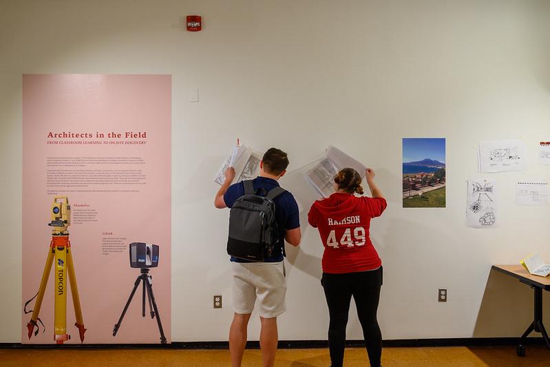 People looking at drawings at the Stabiae Kibel Gallery exhibit