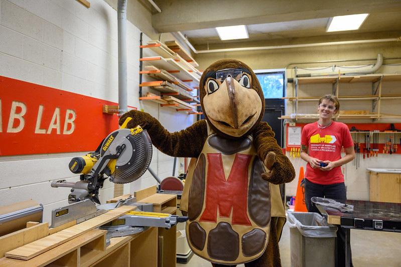 Testudo wearing protective eye gear at the fabrication lab