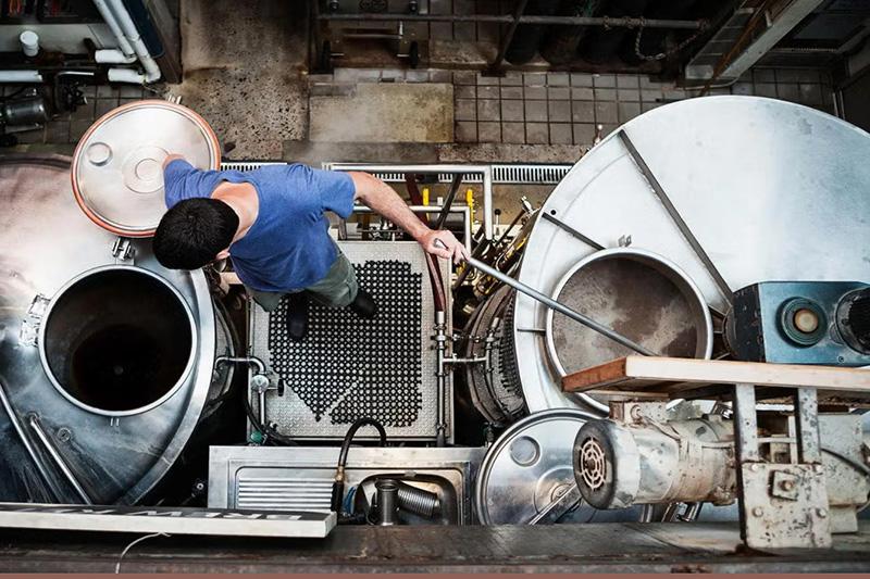 Birds eye view of man working in a brewery