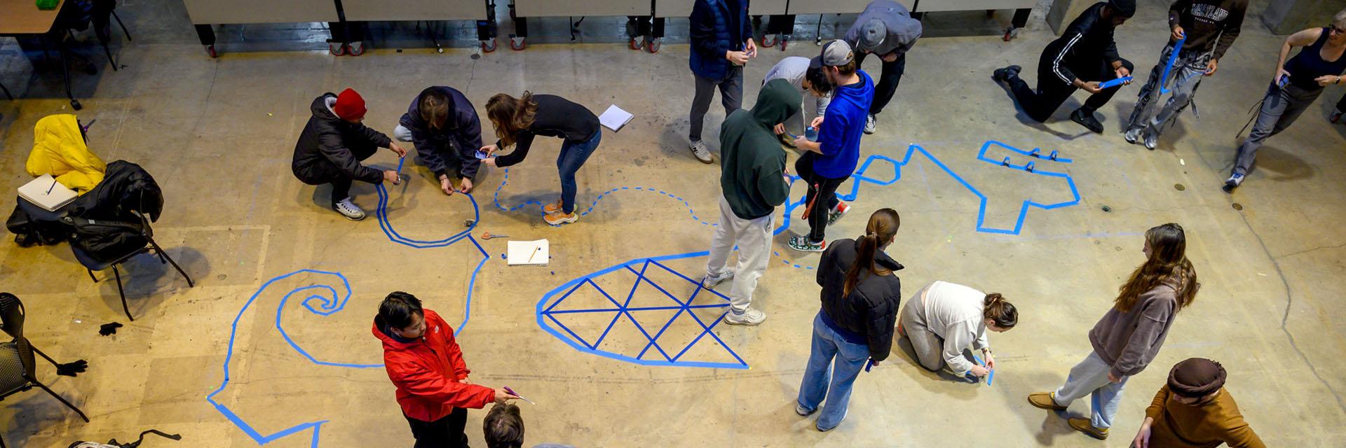 Students working on a tape project in the Great Space