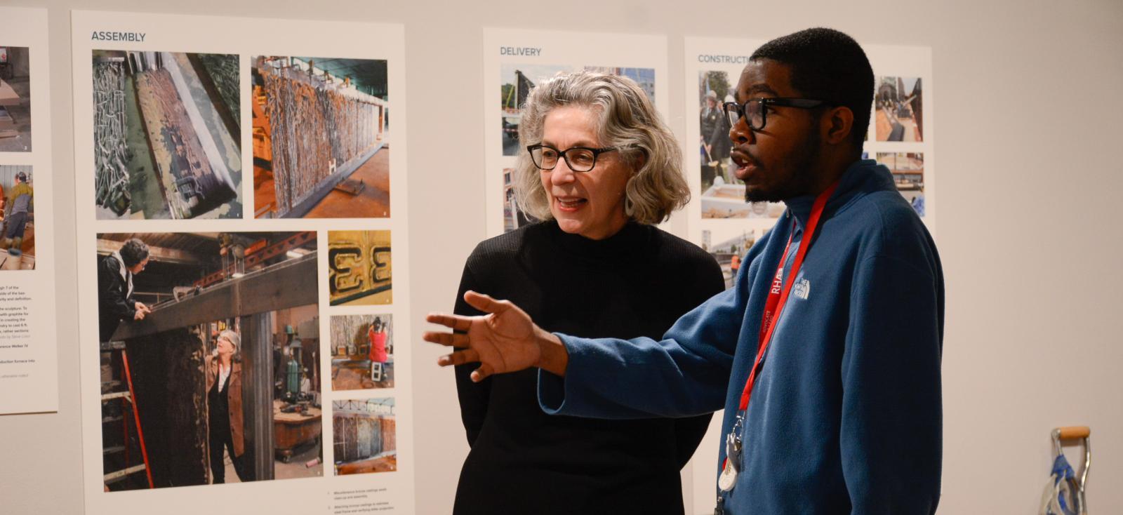 Larysa with student at the exhibit