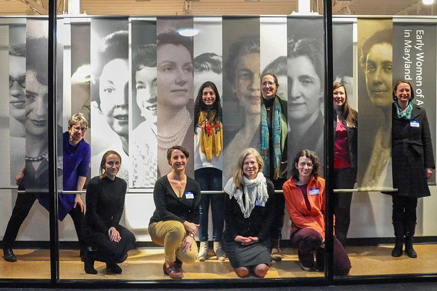 Women standing in front of the Kibel Gallery women-inspired exhibit