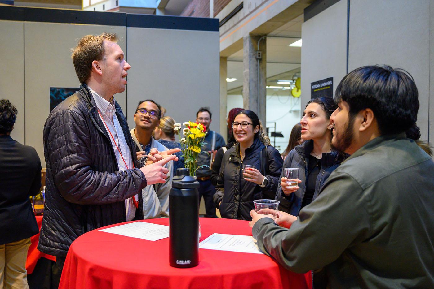 People networking at a career fair reception