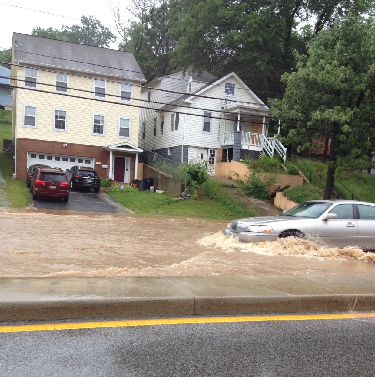 Riverdale Maryland flooded street as a car tries to pass