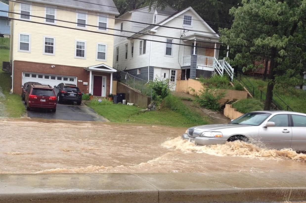 A car going through a flooded street