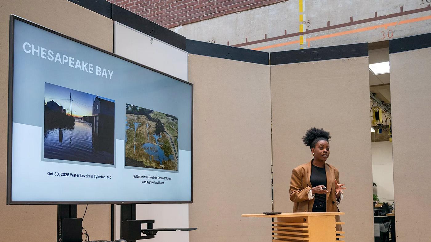 A graduate student pitching an ArchiNova project on the Chesapeake Bay modular vegetation wall.
