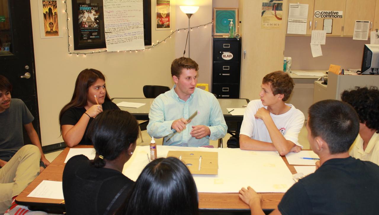 Group of 9 students collaborating 