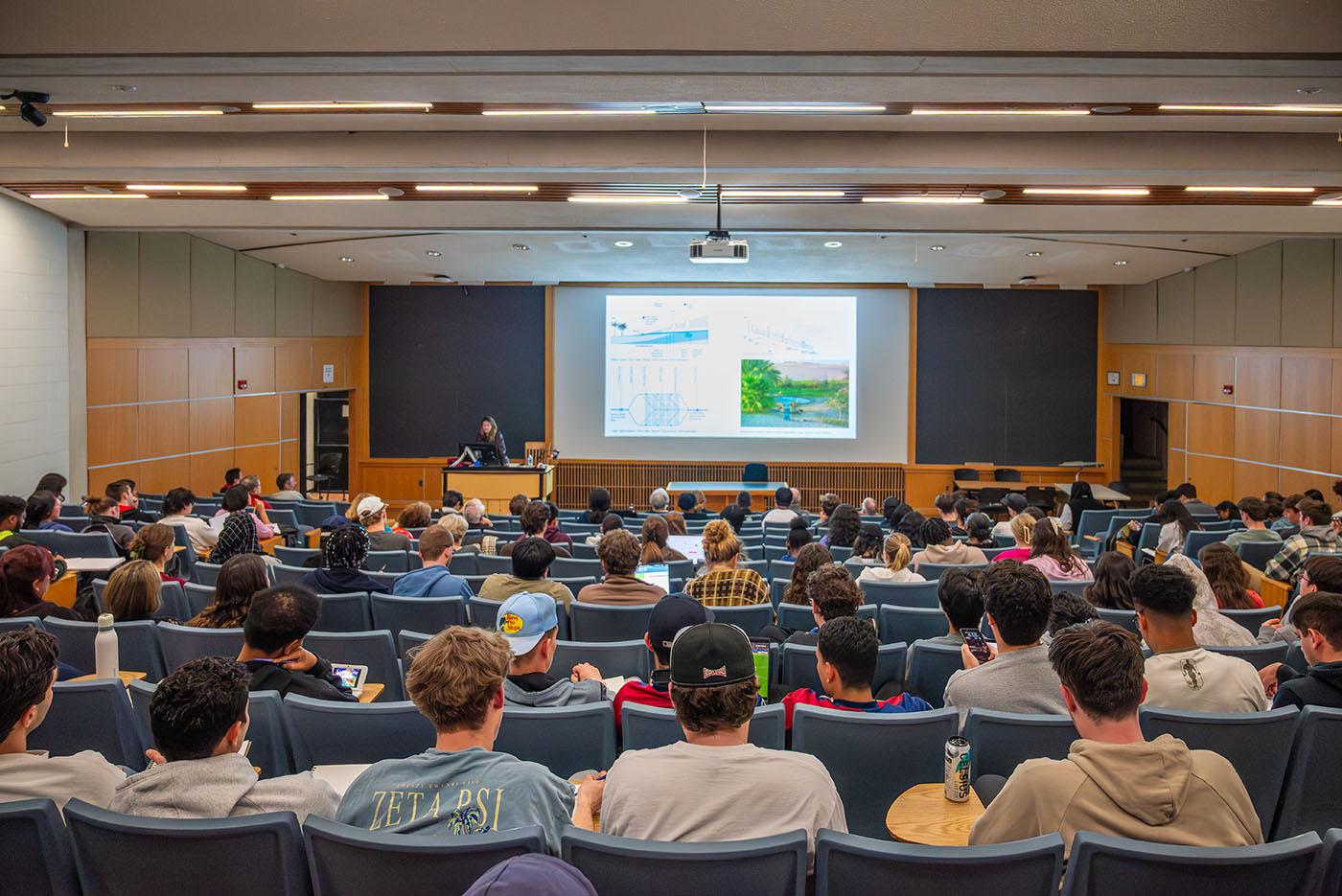 Students filling up the auditorium for a lecture