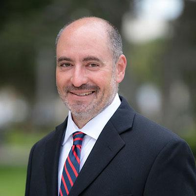 Portrait of Jesse Saginor, Ph.D., AICP, NAIOP Distinguished Fellow