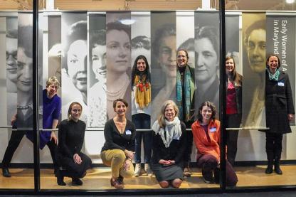 Women standing in front of the Kibel Gallery women-inspired exhibit