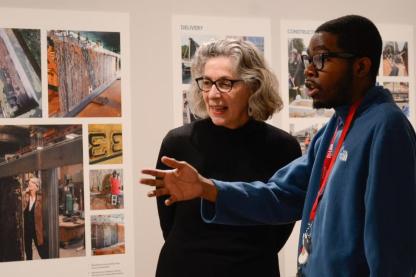 Larysa with student at the Holodomor exhibit