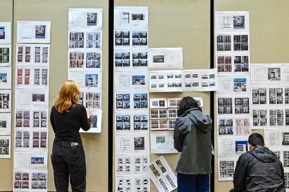Students pinning up AI architecture iterations